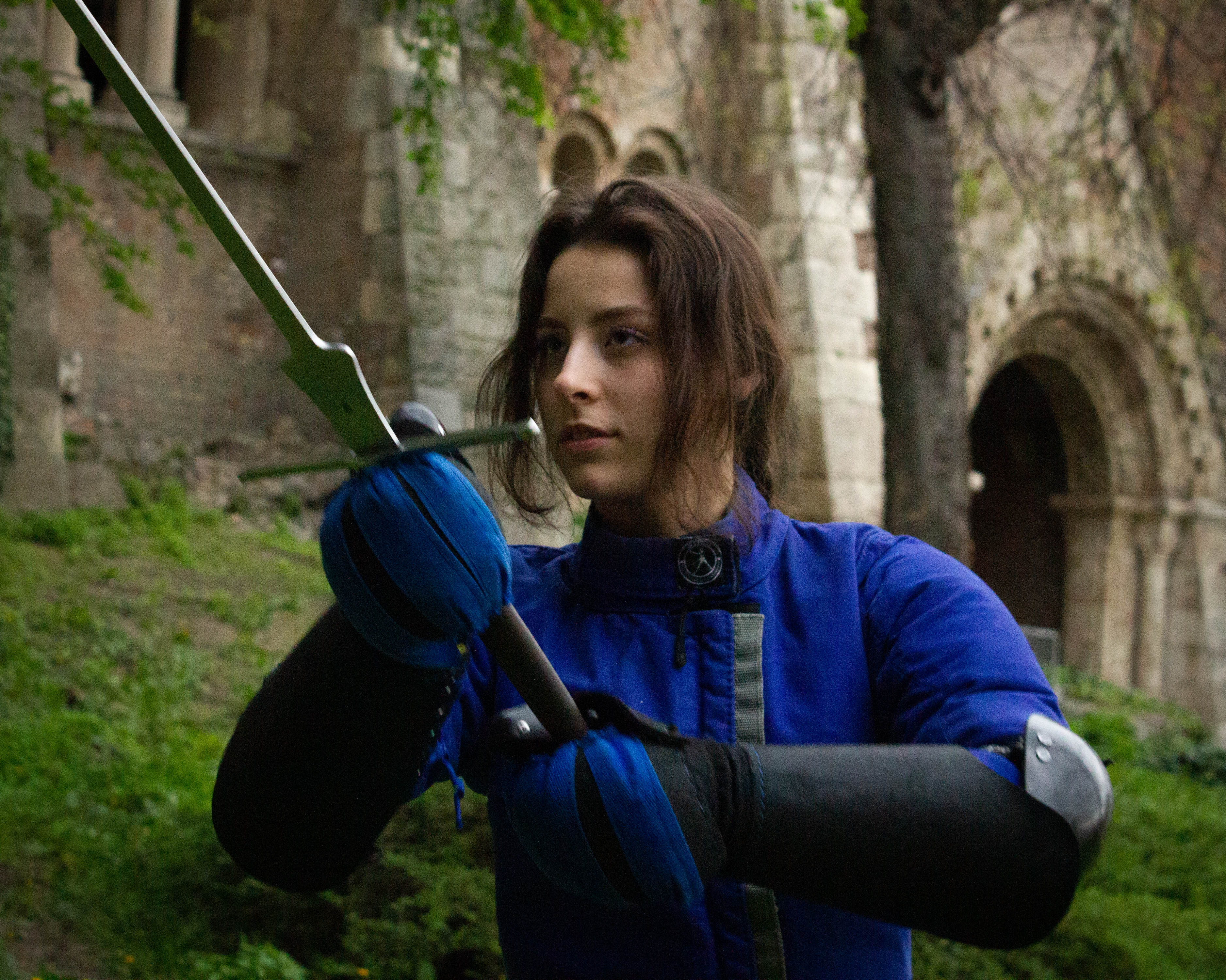 female fencer holding feder swords